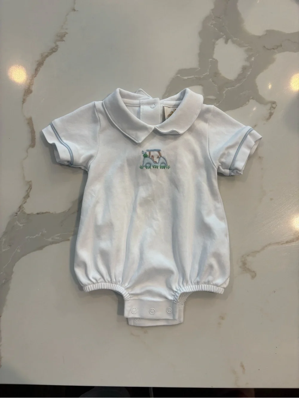 White Baby Polo Romper with Blue Trim and Tractor Embroidery